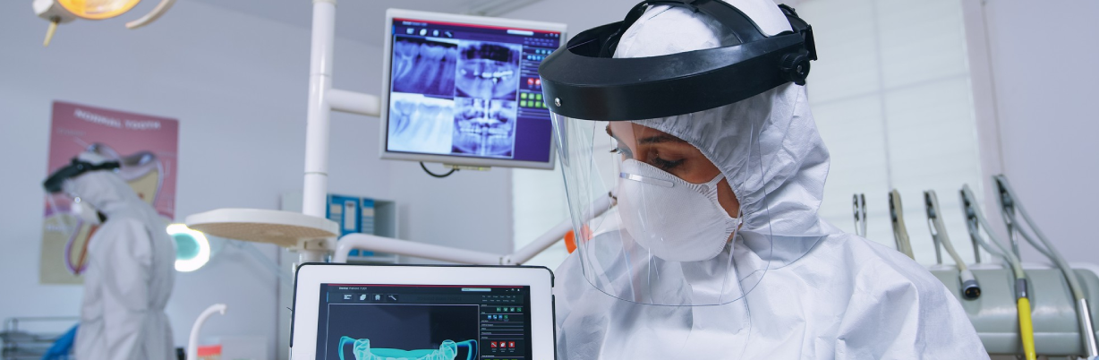 Patient pov listening explication for teeth treatment, dentist in coverall showing x-ray